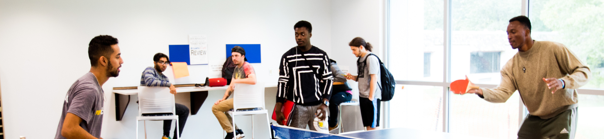 student playing table tennis